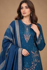 Close up of teal blue Dhanak suit with detailed embroidered neckline and printed shawl