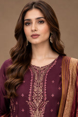 Close up of deep plum Dhanak suit with detailed gold and pink neckline embroidery