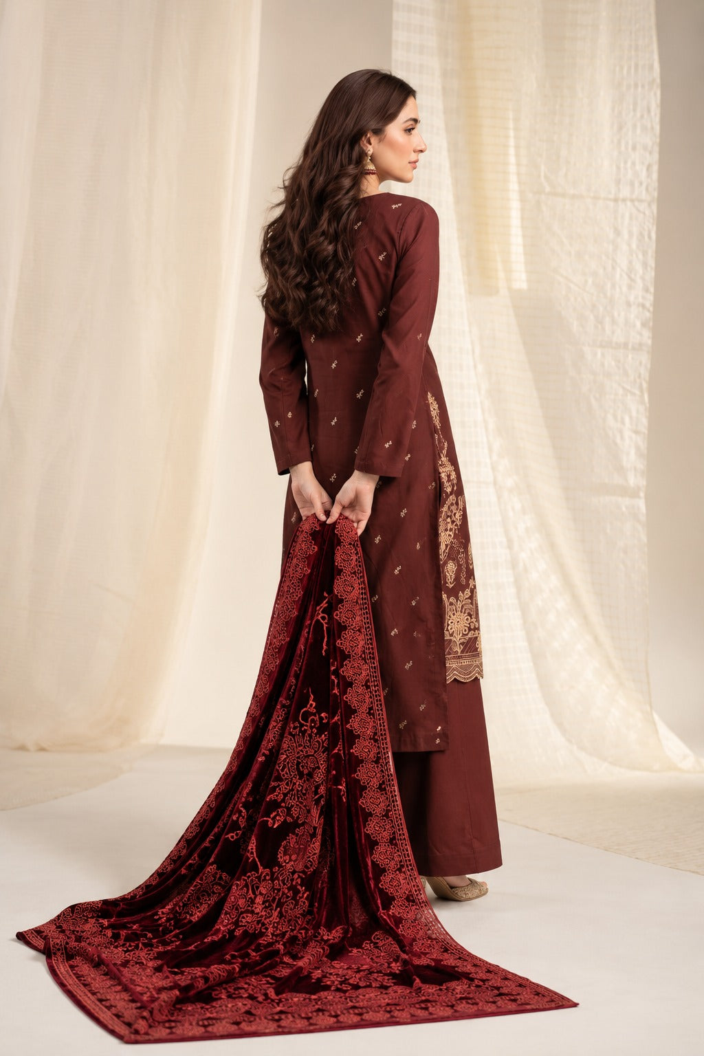 Chocolate Maroon embroidered winter suit with velvet shawl, back view styled on a model