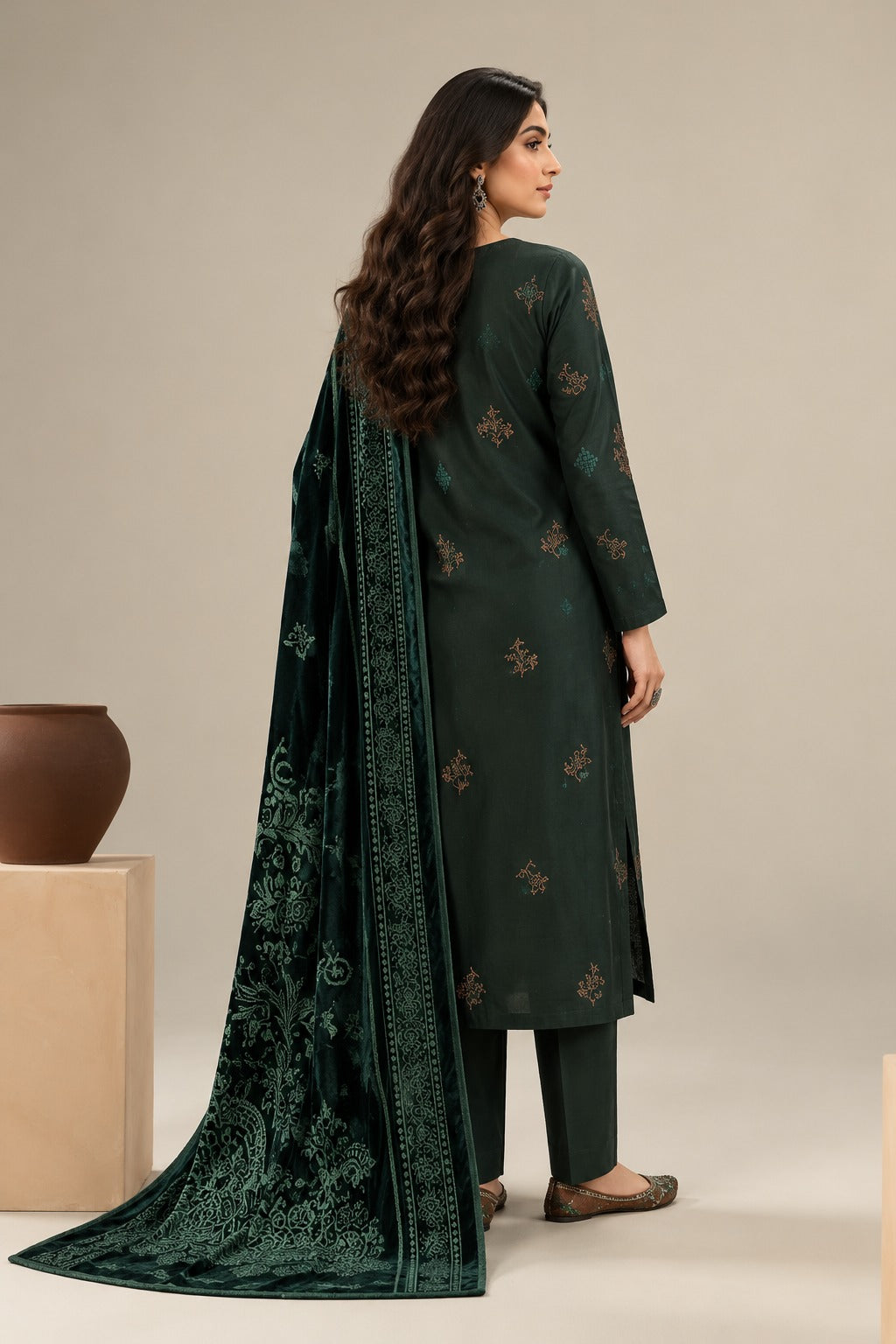 Back view of dark green suit showing embroidered back, sleeves and velvet shawl